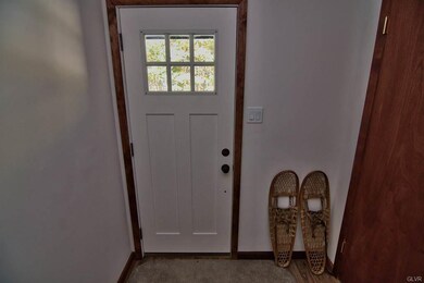 Interior foyer w/ new door, laminate flooring and 