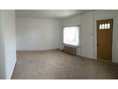 Living Room. New drywall, paint, and wall to wall.