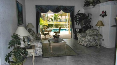 Formal Living Room - full sliders to the pool/lana