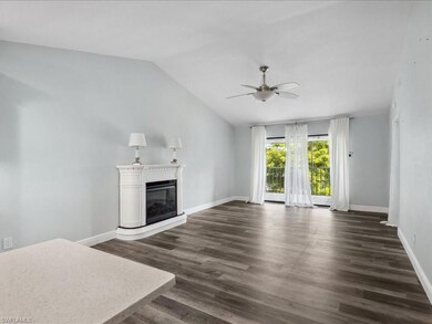 Unfurnished living room with dark hardwood / wood-