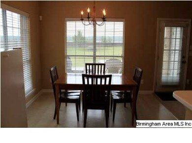 Picture window in Breakfast Room overlooks patio &