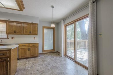 Sliding glass door leads out to deck.