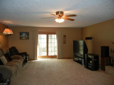 This family room is ~25x18, with a fireplace, slid