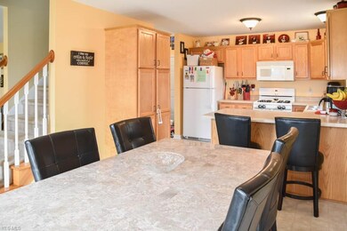 The dining room has a sliding door to the back dec
