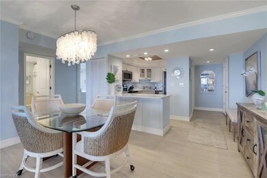 Dining space featuring a chandelier, baseboards, light wood-style flooring, recessed lighting, and ornamental molding