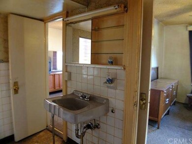 Bathroom adjoining master bedroom and room to righ