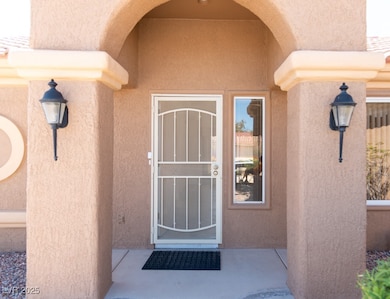Property entrance with stucco siding