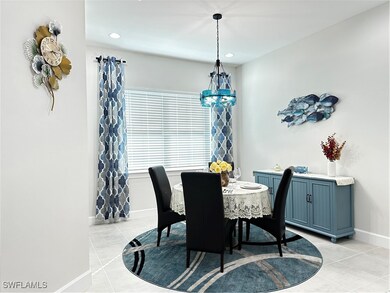 Tiled dining space with a notable chandelier