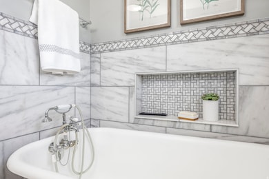 Full bathroom with a bathtub