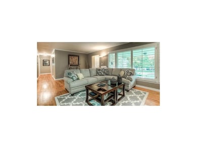 Living Room Opens to Dining Room and Entryway