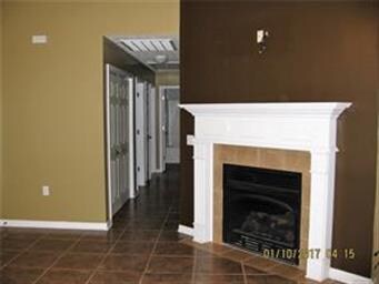 Enjoy the warm fireplace with gas logs. Tile runs 