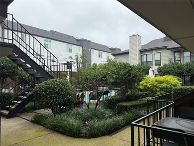 View of community featuring stairway and a pool