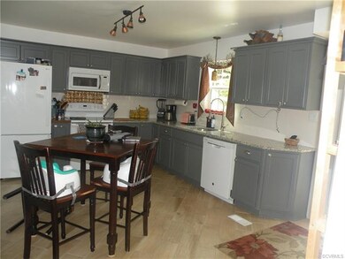 Kitchen with ceramic tile flooring, subway tile ba