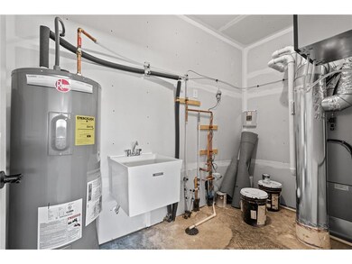 Utility room is off garage and has room for extra 