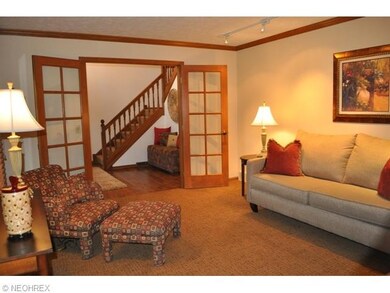 Formal living room with French doors and newer car