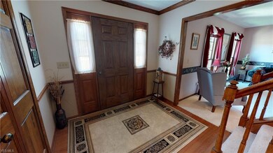 Generous all wood flooring in the entryway,  openi