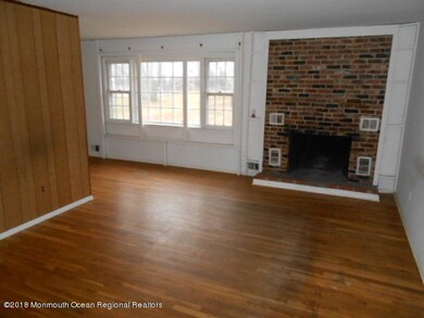 wood floors and fireplace in living room