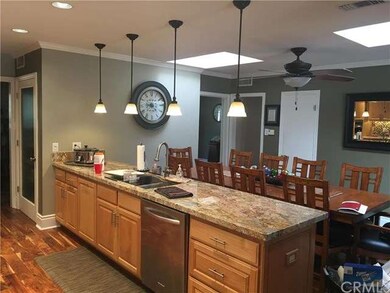 Wide angle view of long counter, and dining room.