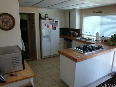 Kitchen opens to dining & family rooms