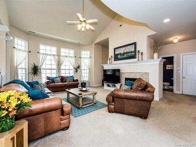Vaulted ceiling 2-story great room features a bay 