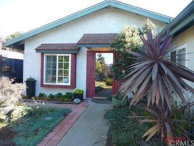 Front entry with mirrored storm door. Front door i