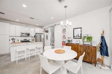 Dining room featuring visible vents, recessed lig