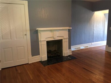 Living room with gas burning fireplace.