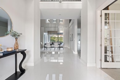Foyer entrance featuring baseboards and tile patt