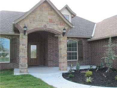 Exterior Front. Large and welcoming front porch wi