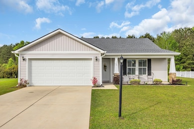View of front facade with a front yard, a porch, d