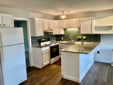Freshly painted kitchen with granite countertops a