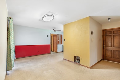 Entry on the right and a view into the dining area