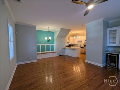 On entry, the open floor plan shows off this modern kitchen