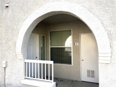 Property entrance featuring stucco siding