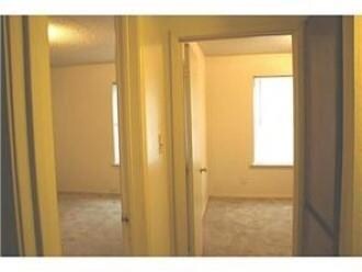 Hallway featuring carpet floors