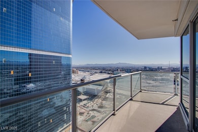 Balcony with a mountain view and a city view