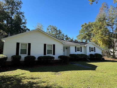 Ranch-style home with a front yard