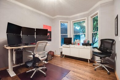 Formal dining space is currently used for home off