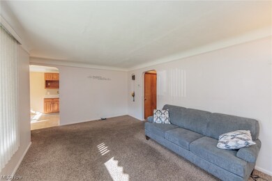 Unfurnished living room with light tile floors