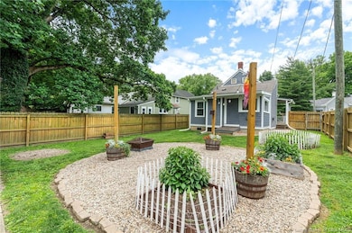 Fantastic fenced in yard, with 2 parking spots and garden