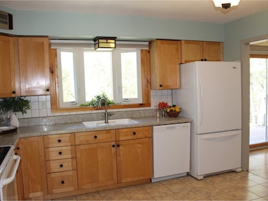 Kitchen overlooks backyard