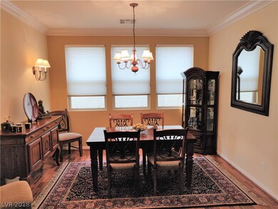 Dining Room: Crown Molding, chandelier and large w