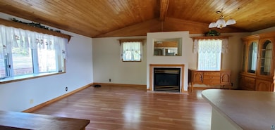 Unfurnished living room featuring a wealth of natu