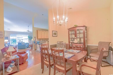 Dining area featuring ceiling fan with notable cha