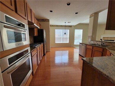 Kitchen with a sink, appliances with stainless st