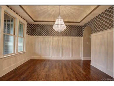 The Dining Room features hardwood floors, custom w