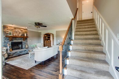 This home has been updated throughout; including shiplap, wrought iron railing with new oak handrails, board and batten detail and wood header trim over all the doorways!