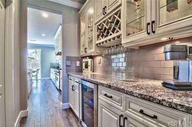 Butler pantry with glass doors and a wine frig!