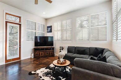 Living area with finished concrete floors, a ceil