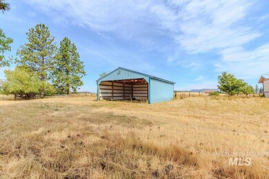 View of yard with an outbuilding and a view of countryside